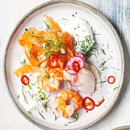 Cured salmon with prawns, pickled salad & dill lime crème fraîche