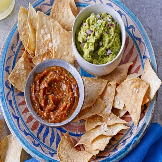 Homemade tortilla chips with guacamole & charred tomato salsa