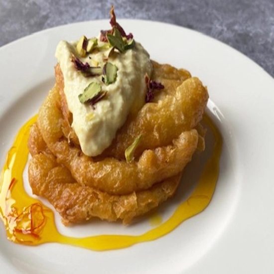 Indian pancakes with saffron & rosewater cream (malpua & rabri)
