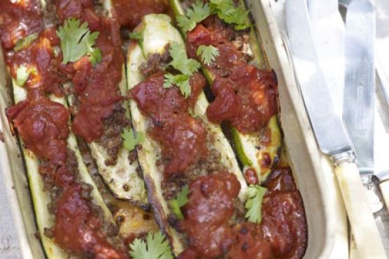 Baked courgettes stuffed with spiced lamb & tomato sauce